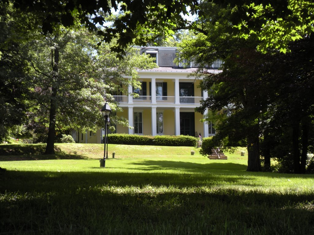 Baldwin Reynolds house during the summer time with full green trees